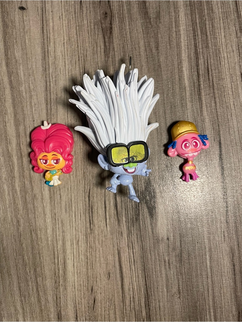 collection of small plastic figurines from the Trolls World Tour happy meal 2020